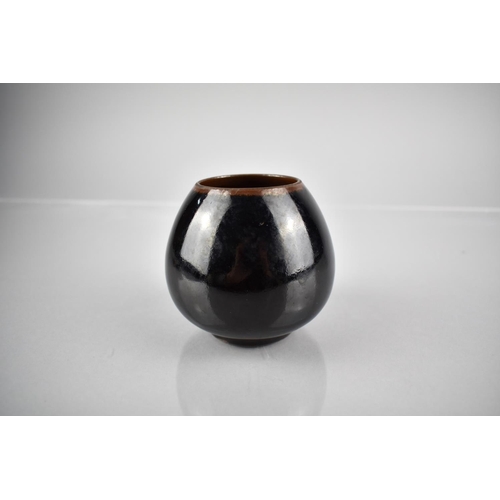 228 - A Chinese Black Glazed Pot of Globular Form, 8cm High
