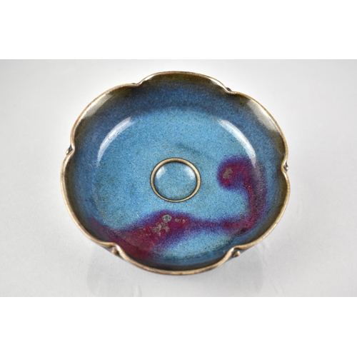 225 - A Chinese Jun Ware Glazed Scalloped Edged Bowl with Central Circular Well, 13.5cm Diameter