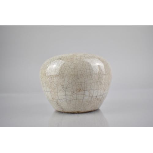 220 - A Chinese White Crackle Glazed Pot of Squat Globular Form, 7.5cms High