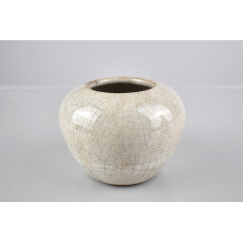 220 - A Chinese White Crackle Glazed Pot of Squat Globular Form, 7.5cms High