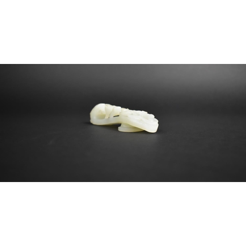 337 - A Chinese White Jade Chi Dragon Belt Buckle, 12cms