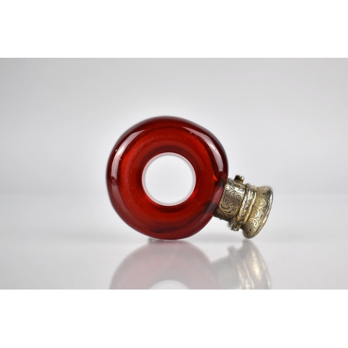 178 - A 19th Century White Metal Mounted Ruby Glass Scent Bottle of Torus/ Ring Form, The Lid With Chased ... 