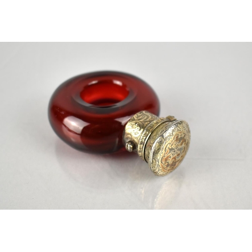 178 - A 19th Century White Metal Mounted Ruby Glass Scent Bottle of Torus/ Ring Form, The Lid With Chased ... 