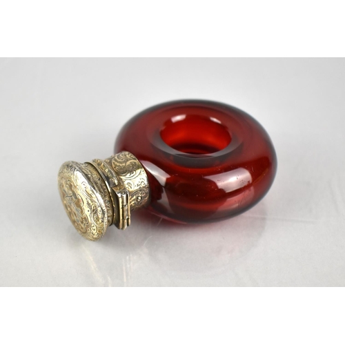 178 - A 19th Century White Metal Mounted Ruby Glass Scent Bottle of Torus/ Ring Form, The Lid With Chased ... 