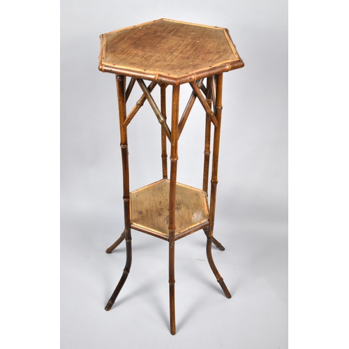 48 - A Late 19th/20th Century Bamboo Rattan Octagonal Stand with Stretcher Shelf, 77cm High