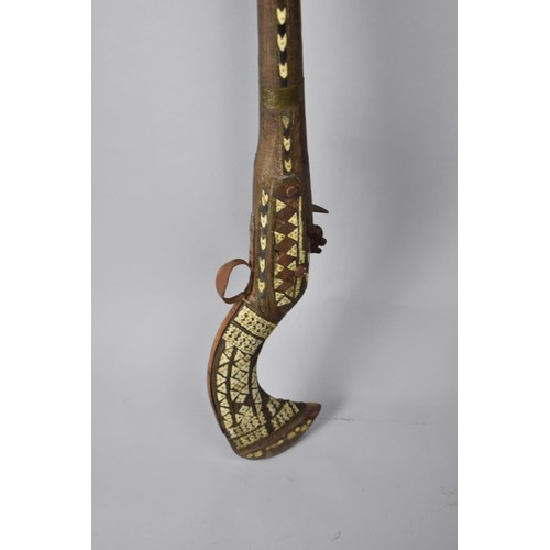 67 - A 19th Century Flintlock Jezail Iron Barrel with Flared Muzzle, the Wooden Stock with Brass and Bone... 