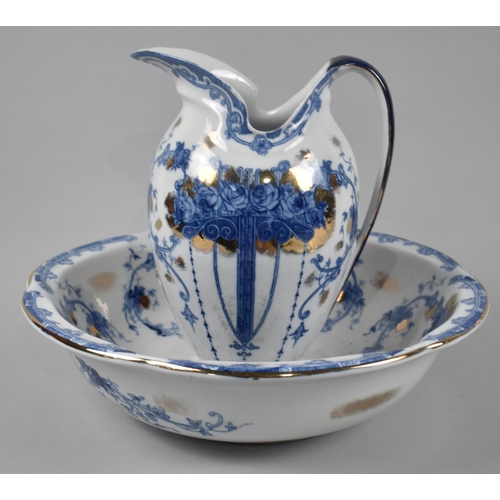 131 - An Edwardian Blue, White and Gilt Decorated Toilet Jug and Bowl