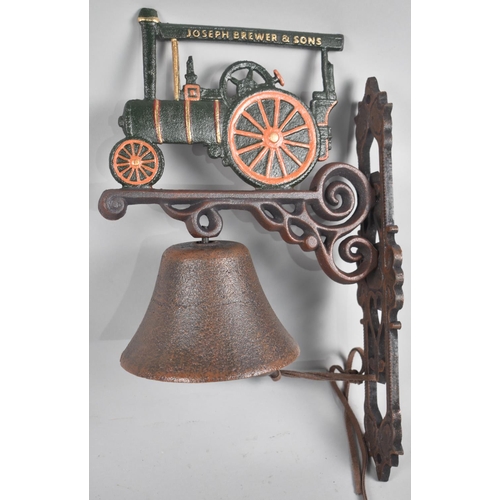 135 - A Reproduction Cast Metal Wall Hanging Doorbell with Traction Engine Mount, 37cms High Plus VAT