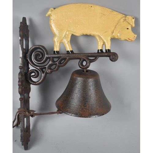 136 - A Reproduction Cast Metal Wall Hanging Doorbell in the Form of a Pig, 33cms High Plus VAT