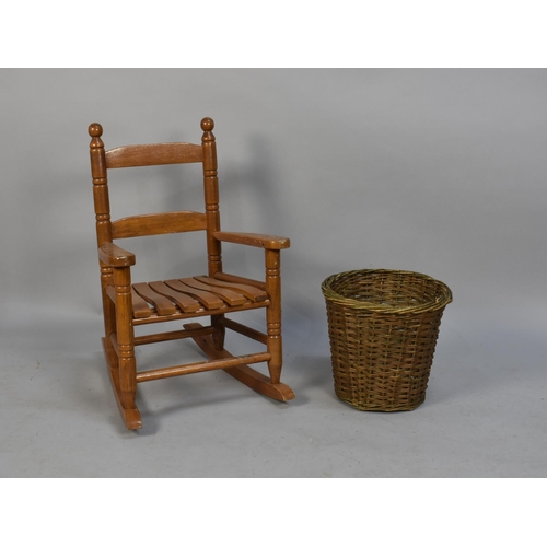 211 - A Mid/Late 20th Century Children's Ladder Back Rocking Chair together with a Wicker Waste Bin