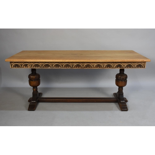 215 - A Mid 20th Century Oak Rectangular Coffee Table with Twin Bulbous Supports, 132cms by 57cms