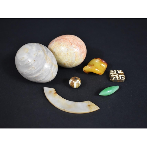 235 - A Small Collection of Various Items to Comprise Chinese Jade Items, Polished Stone Eggs, Amber Piece... 