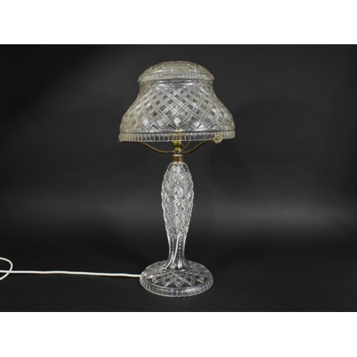 300 - A Nice Quality Cut Glass Lamp and Shade, 56cm high