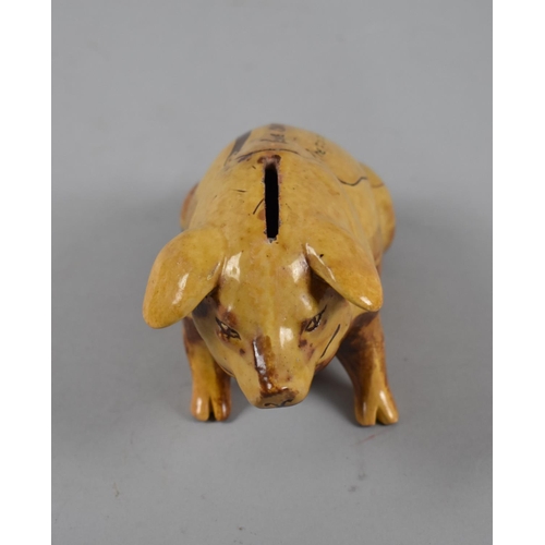 327 - A Ewenny Pottery Glazed Piggy Bank Inscribed 'Take Care of the Pence. The Pounds will Take Care of T... 