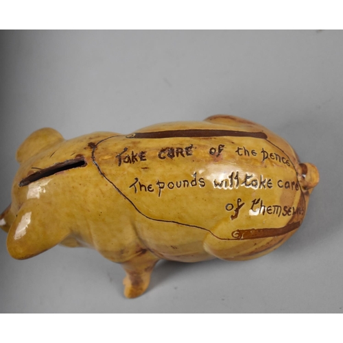 327 - A Ewenny Pottery Glazed Piggy Bank Inscribed 'Take Care of the Pence. The Pounds will Take Care of T... 