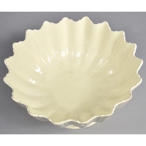 330 - A 19th Century Creamware Footed Bowl of Reeded Form with Wavy Rim, 24cm diameter and 12.5cm high