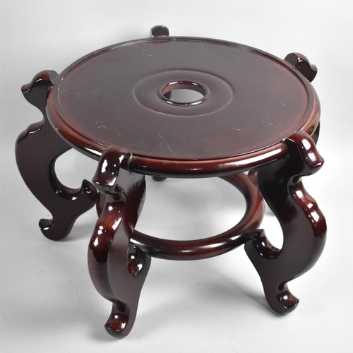 39 - A Modern Oriental Mahogany Vase Stand, 32cms Diameter and 25cms High