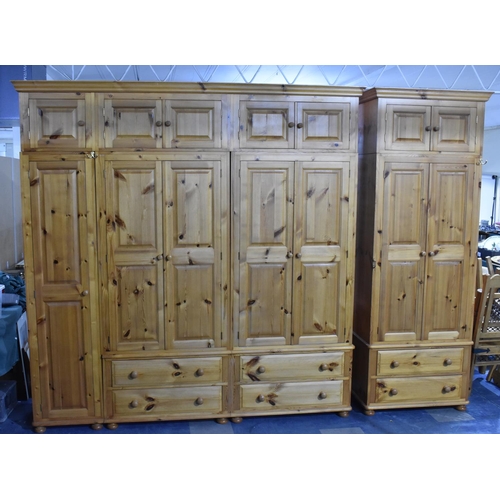 392 - A Large Modern Pine Fitted Bedroom Unit with Hanging Sections, Four Drawers and Raised Cupboards 228... 