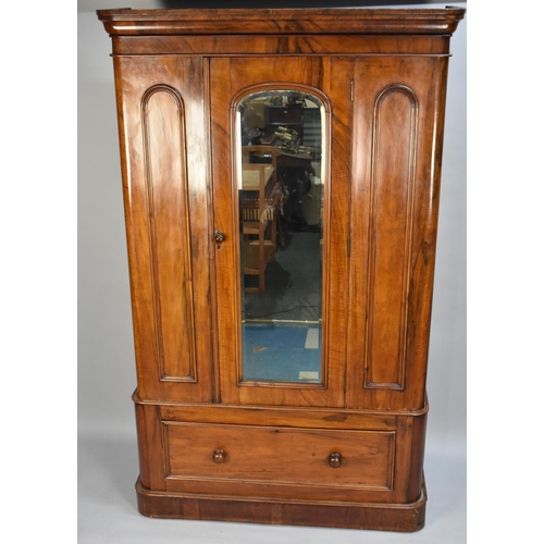 412 - A Victorian Mahogany Double Wardrobe with Mirror Door and Base Drawer, 116cms Wide