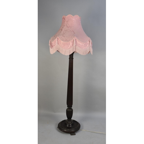 416 - An Edwardian Standard Lamp with Reeded Column Support and Circular Base, Complete with Pink Shade