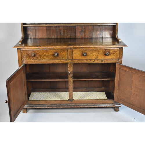 420 - A Mid 20th Century Oak Dresser with Two Drawers Over Cupboards, Three Shelf Plate Rack, 122cms Wide