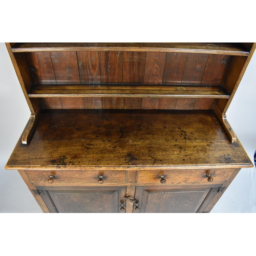 420 - A Mid 20th Century Oak Dresser with Two Drawers Over Cupboards, Three Shelf Plate Rack, 122cms Wide