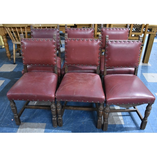 424 - A Set of Six Edwardian Oak Framed Hide Seated  Brass Studded Dining Chairs