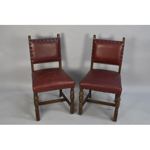 424 - A Set of Six Edwardian Oak Framed Hide Seated  Brass Studded Dining Chairs