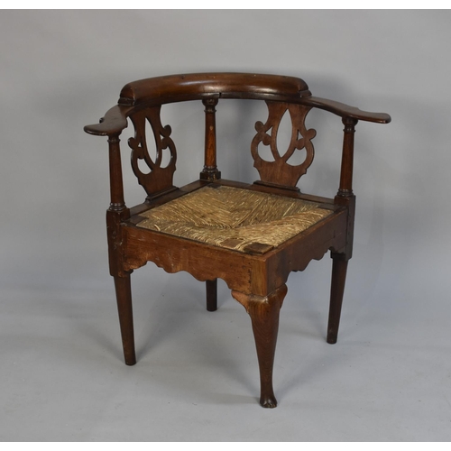 429 - A 19th Century Oak Framed Corner Armchair with Rush Seat