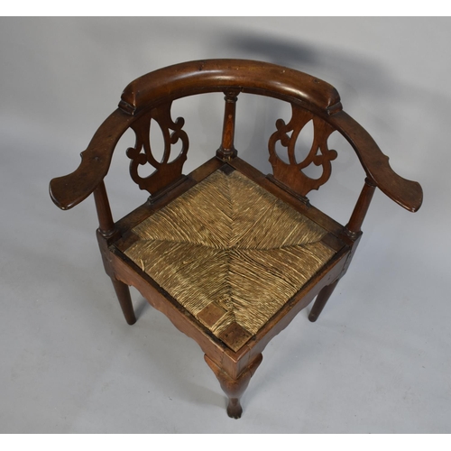 429 - A 19th Century Oak Framed Corner Armchair with Rush Seat