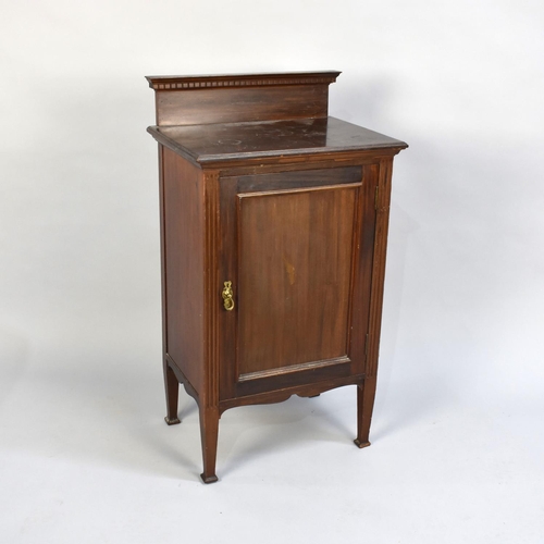 46 - An Edwardian Mahogany Bedside Cupboard with Panelled Door and Raised Gallery Back, 48cms Wide