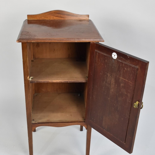 47 - An Edwardian Mahogany Bedside Cupboard with Panelled Door to Shelved Interior and Raised Rear Galler... 