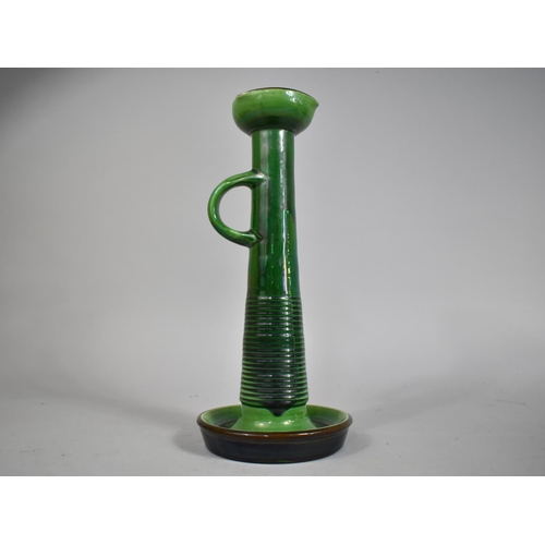 52 - A Tall Green Glazed Terracotta Candlestick by Bretby, 35cms High