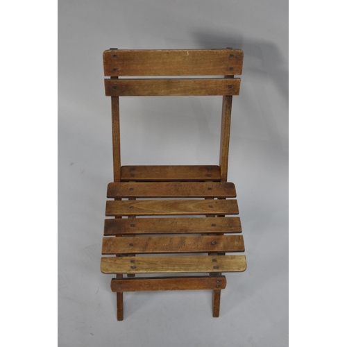 61 - A Small Folding Childs Chair