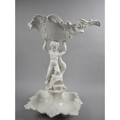 76 - A Large Tall White Glazed Continental Table Centre in the Form of Cherub with Dolphin, Condition Iss... 