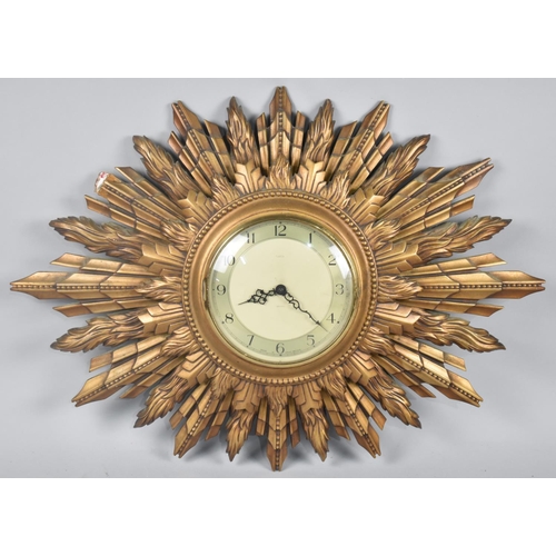 91 - A Vintage Smiths Gilt Starburst Wall Clock, 66x49cms