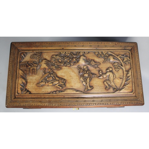 A Nicely Carved Camphor Wood Chest Decorated with Chinese Gods and Dragons  in Exterior Setting, 89x4