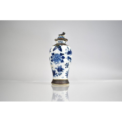 301 - A Chinese Porcelain Blue and White Nanking Crackle Glazed Baluster Vase and Cover, decorated with Bu... 