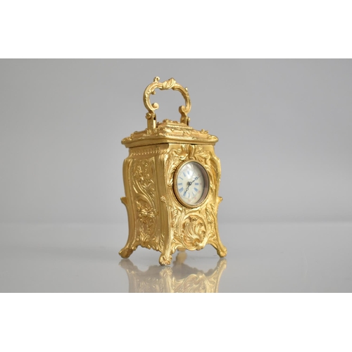 443 - A Miniature Gilt Bronze Reproduction Carriage Clock in the French Art Nouveau, with Key and Working ... 