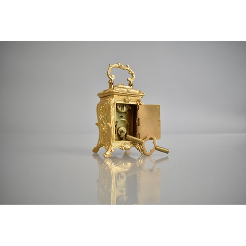 443 - A Miniature Gilt Bronze Reproduction Carriage Clock in the French Art Nouveau, with Key and Working ... 