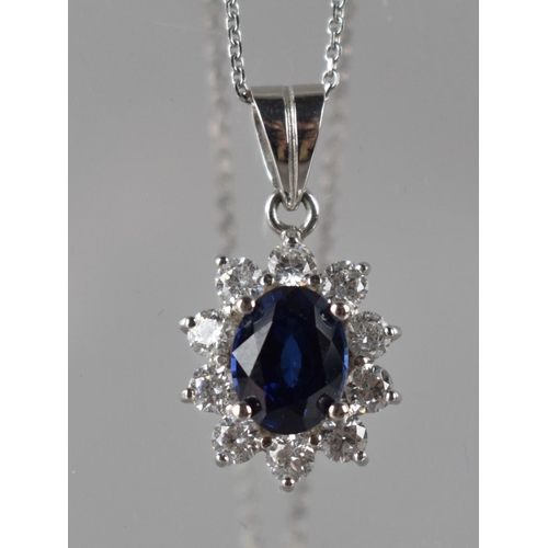 237 - A 9ct White Gold Mounted Sapphire and CZ Pendant on Chain, Oval Cut Central Stone Measuring 9mm by 6... 