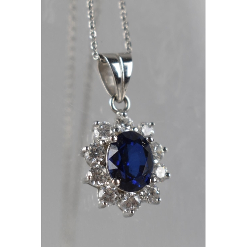 237 - A 9ct White Gold Mounted Sapphire and CZ Pendant on Chain, Oval Cut Central Stone Measuring 9mm by 6... 