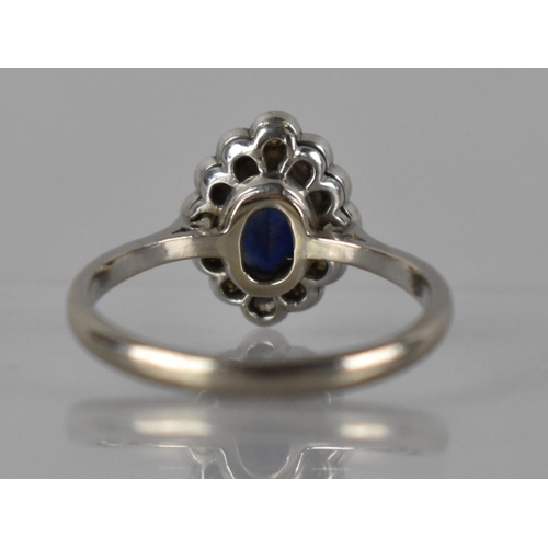 30 - A Sapphire, Diamond and 18ct White Gold Ring, Large Oval Cut Sapphire Measuring 8mm by 5.5mm in Eigh... 