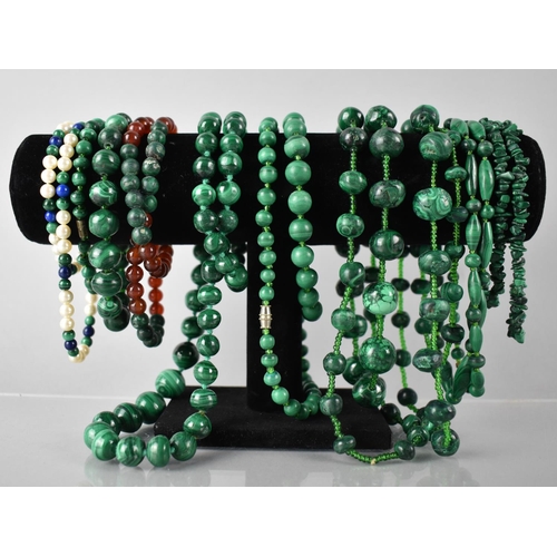 206 - A Collection of Nine Malachite Bead Necklaces