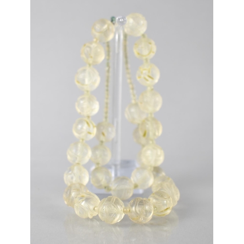 209 - An Eastern Carved Rock Crystal Bead Necklace Comprising 29 Carved Spherical Beads, 11mm Diameter, Pu... 