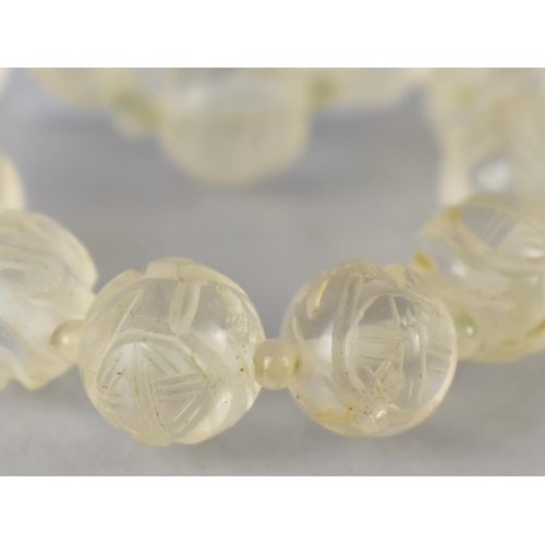 209 - An Eastern Carved Rock Crystal Bead Necklace Comprising 29 Carved Spherical Beads, 11mm Diameter, Pu... 