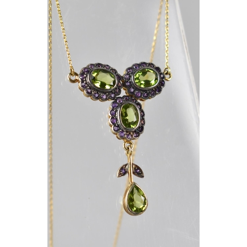 65 - An 9ct Gold Chain Ornately Mounted with Peridot, Amethyst Floral Motif in Gilt Silver, Three Oval Cu... 