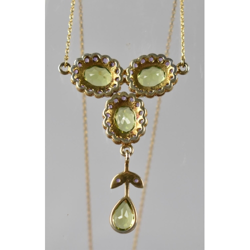 65 - An 9ct Gold Chain Ornately Mounted with Peridot, Amethyst Floral Motif in Gilt Silver, Three Oval Cu... 