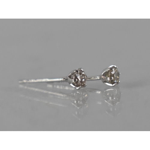 66 - A Pair of Platinum and Diamond Stud Earrings Featuring Round Brilliant Cut Diamonds In Six Claws, (W... 