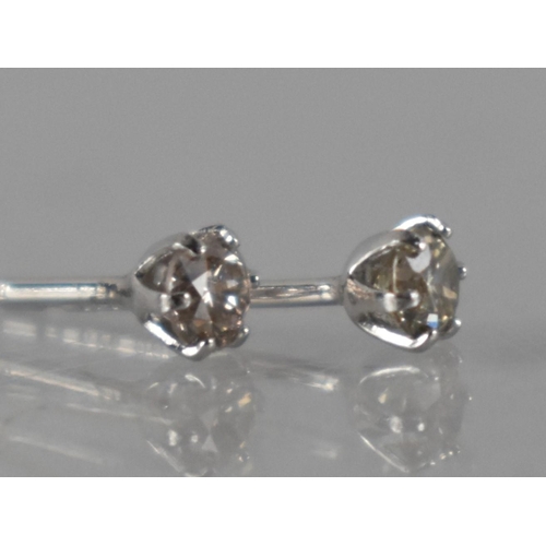 66 - A Pair of Platinum and Diamond Stud Earrings Featuring Round Brilliant Cut Diamonds In Six Claws, (W... 